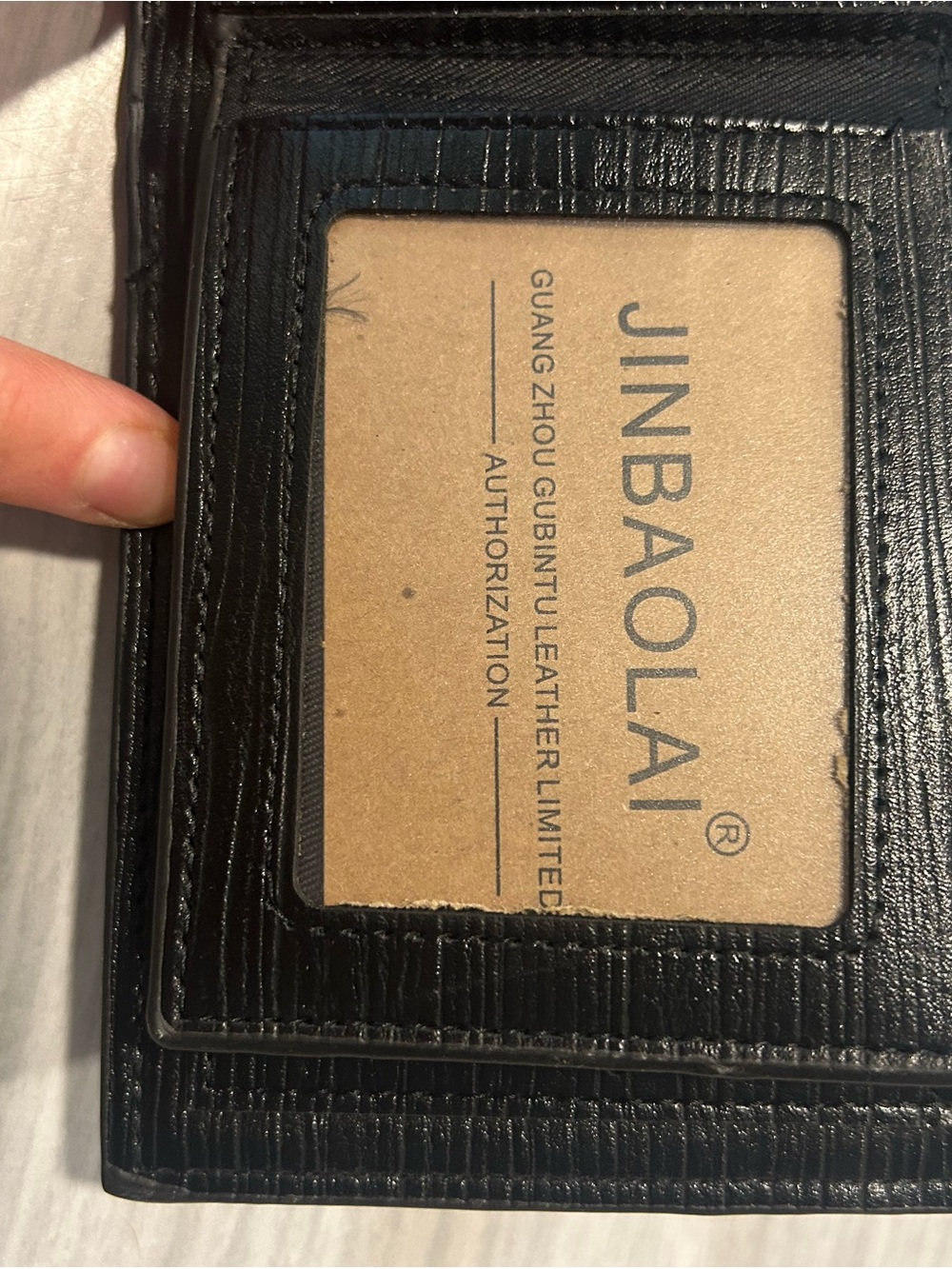 Men's Black Leather Bi-Fold Wallet with Embossed Face and Yellow Eye Accent - Picture 9 of 14
